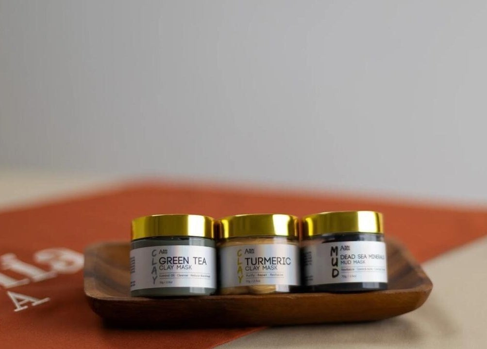 Jars of clay masks on a wooden tray at Iremia Home Spa I إريميا هوم سبا, Home Service, خدمة منزلية, Riyadh Province, SA.