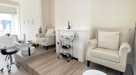 Cozy relaxation area at Irini's Beauty Salon, Brighton And Hove, with plush chairs and manicure setup.