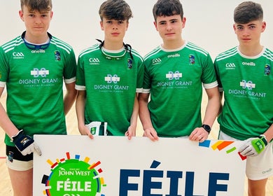 Saval Handball team members posing with a banner in Newry, Northern Ireland, GB.
