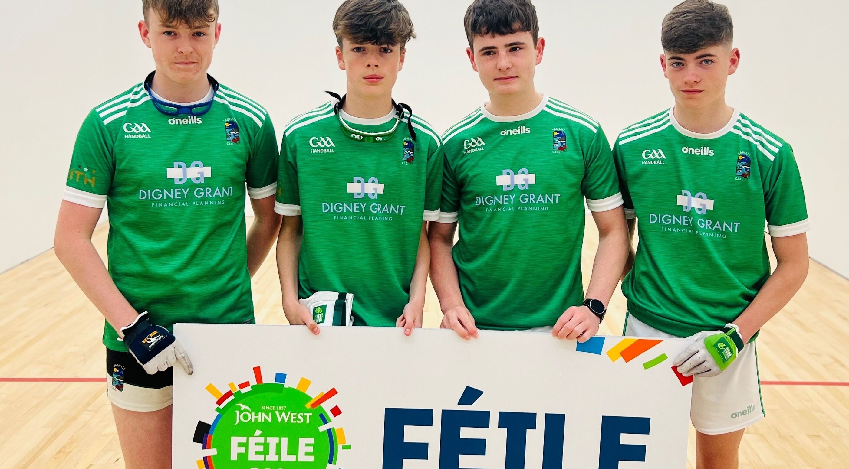 Saval Handball team members posing with a banner in Newry, Northern Ireland, GB.