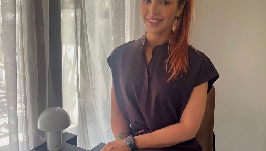 Friendly consultant at Glow With Me Alexia, Melbourne, Victoria, AU, in a warm, inviting atmosphere.