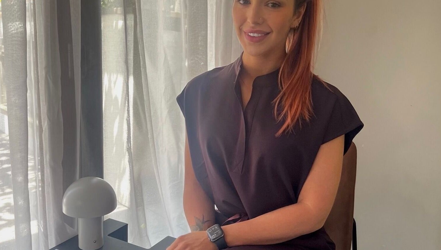 Friendly consultant at Glow With Me Alexia, Melbourne, Victoria, AU, in a warm, inviting atmosphere.