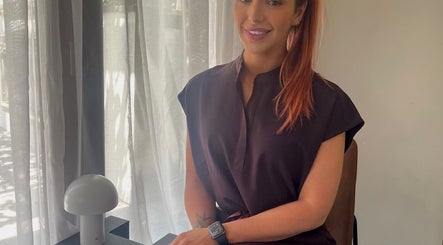 Friendly consultant at Glow With Me Alexia, Melbourne, Victoria, AU, in a warm, inviting atmosphere.