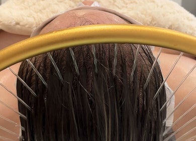Client enjoys a luxurious scalp treatment at The Glow Collective, Lichfield, England, GB.