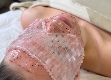 Relaxing rose quartz facial mask at The Glow Collective, Lichfield, England, GB for a rejuvenating spa experience.