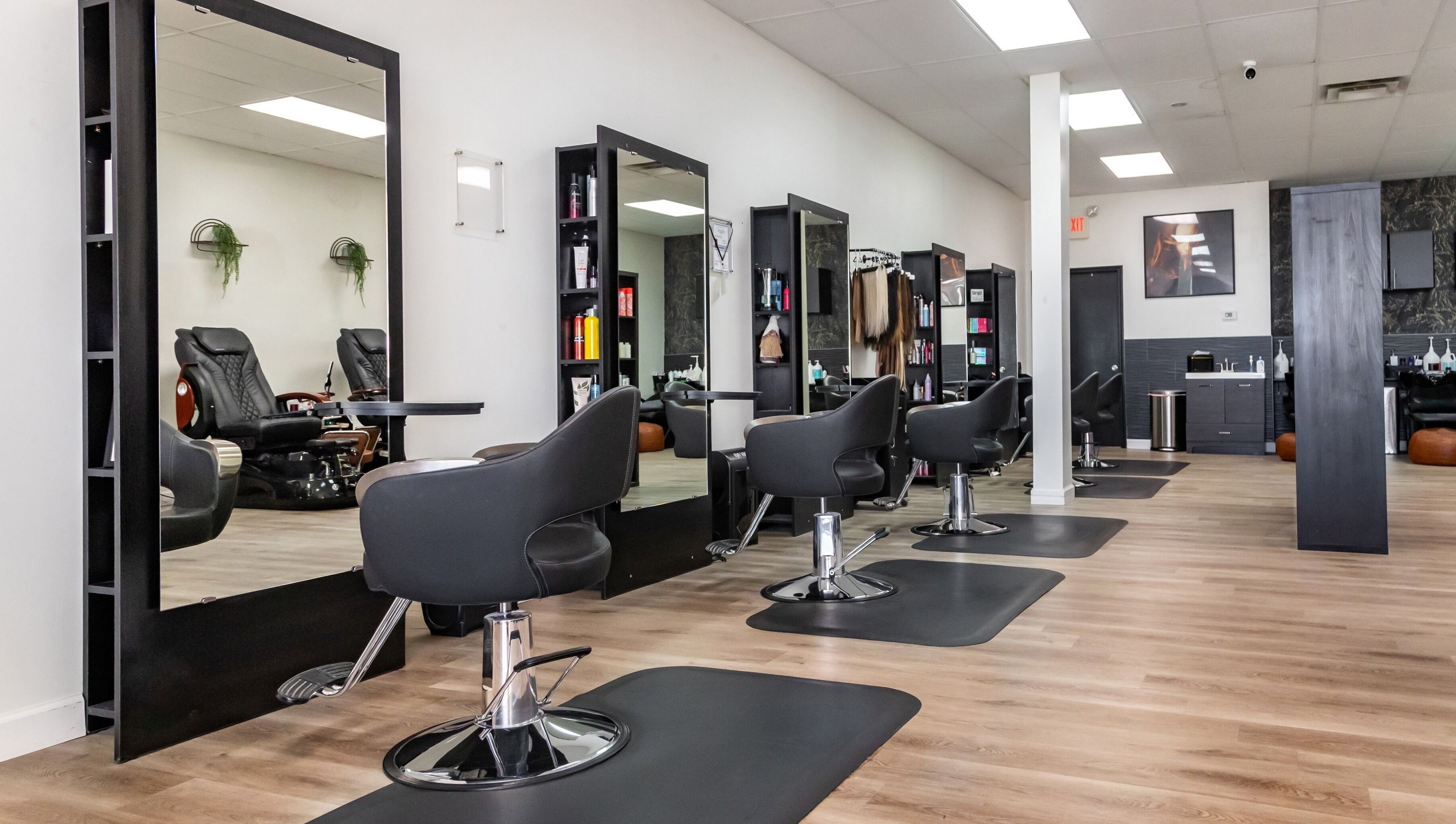 Modern salon interior at Just in Style, St. Louis, Missouri, US, featuring stylish stations and seats.