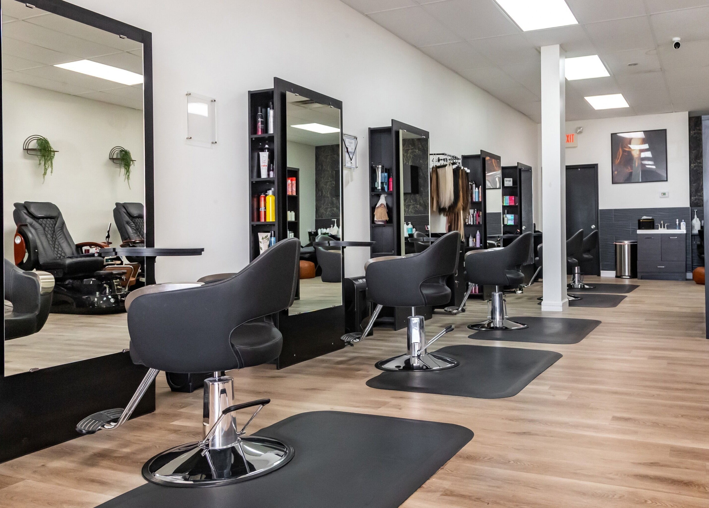 Modern salon interior at Just in Style, St. Louis, Missouri, US, featuring stylish stations and seats.