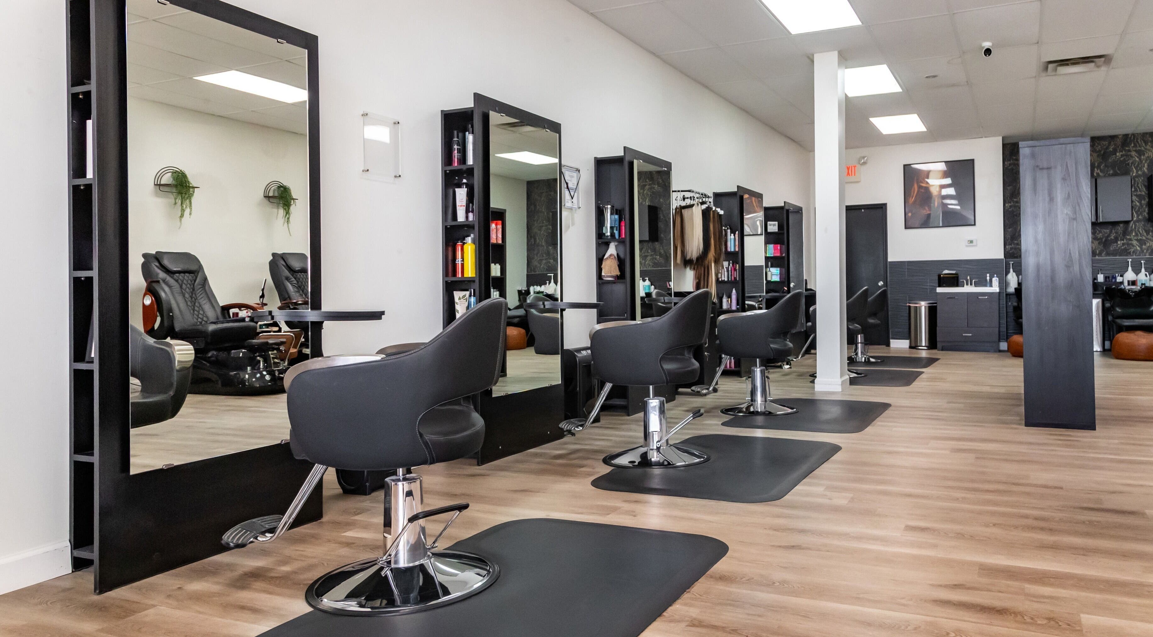 Modern salon interior at Just in Style, St. Louis, Missouri, US, featuring stylish stations and seats.