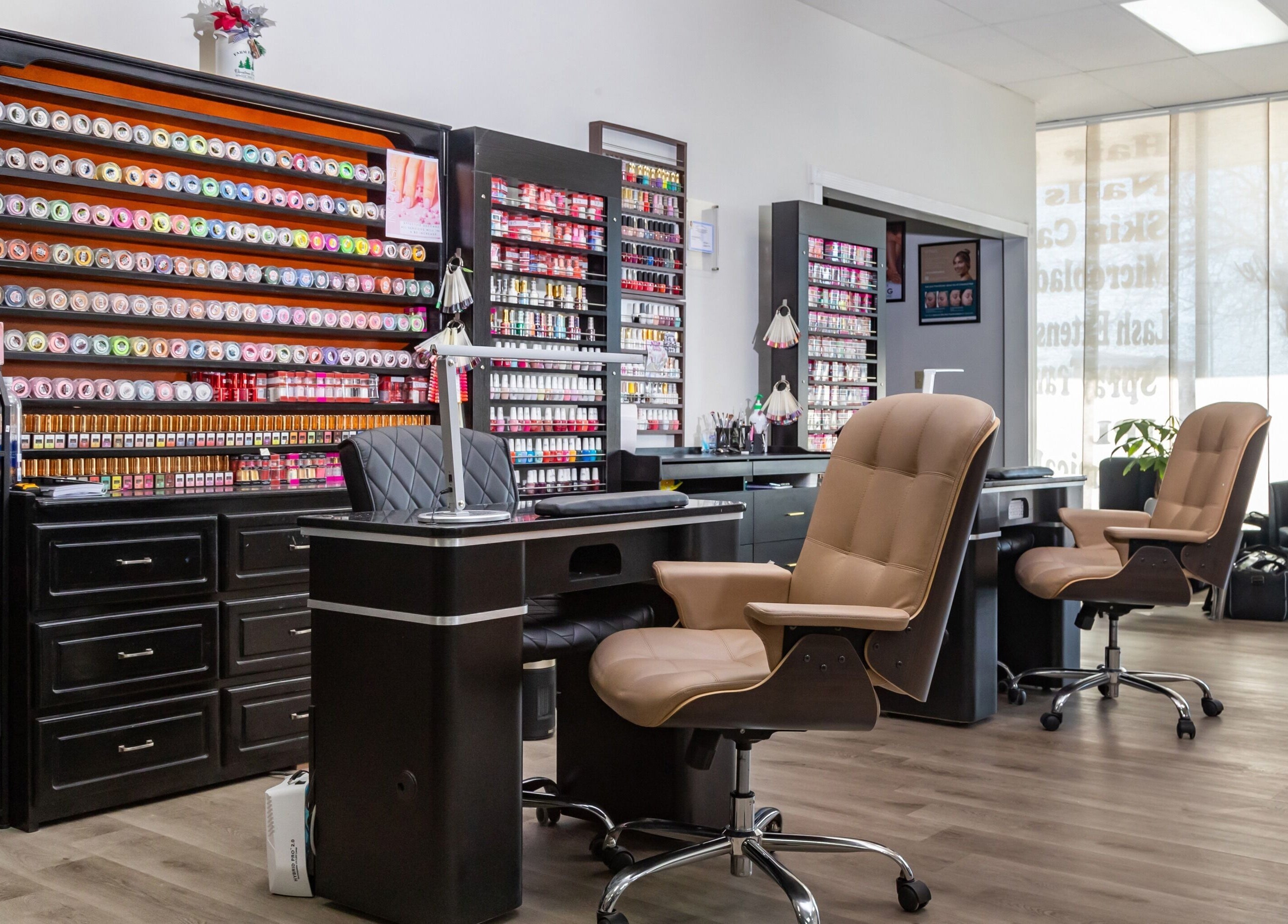 Modern nail care station at Just in Style, St. Louis, Missouri, US offering extensive polish selection.