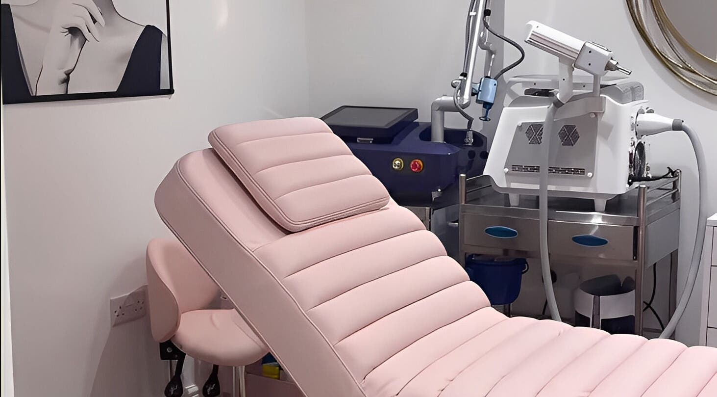 Luxurious treatment room at Ethereal Aesthetics, London, England, GB with modern equipment and pink therapy chair.