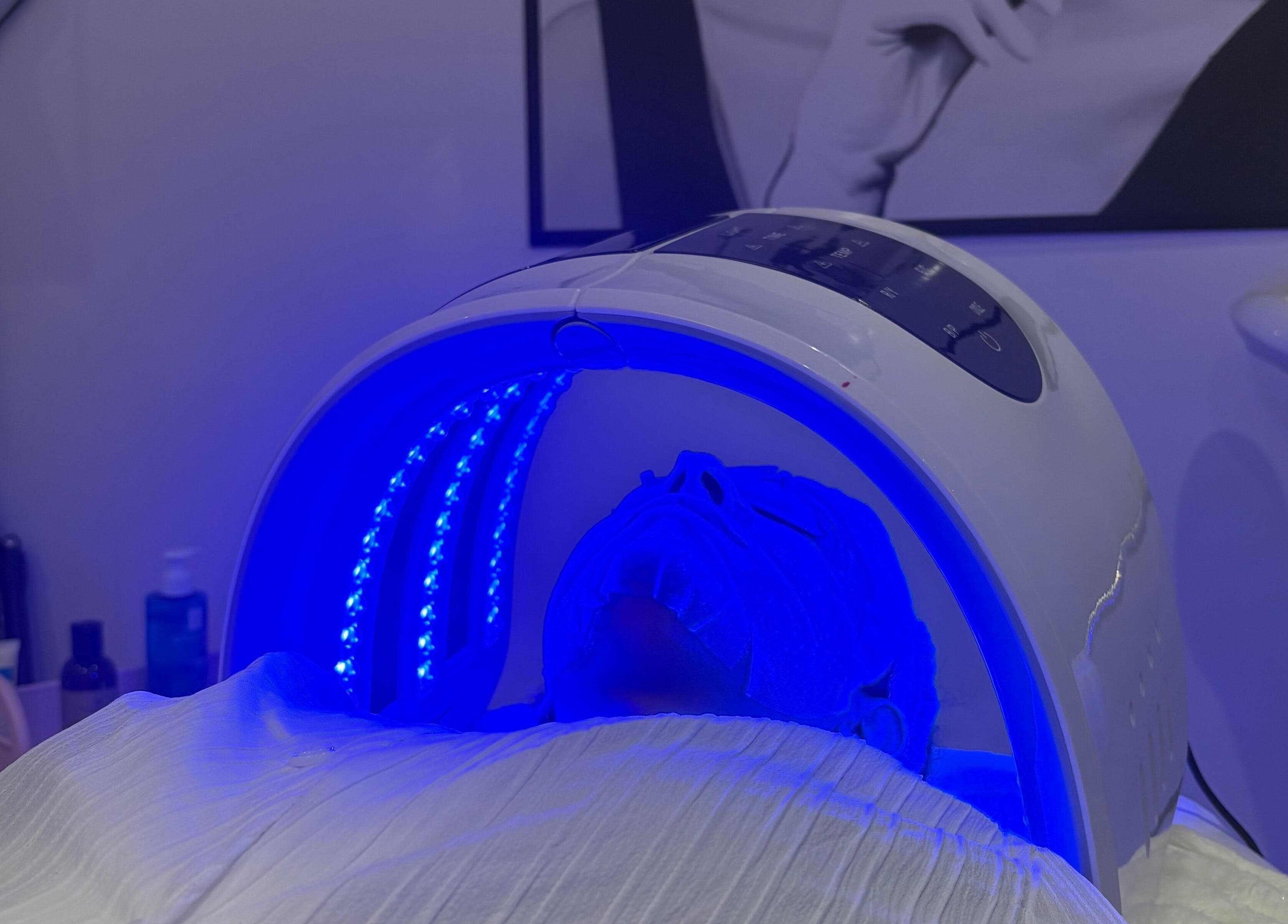 LED facial treatment at Ethereal Aesthetics, London, England, GB, enhancing skin wellness under blue light.
