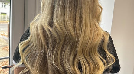 Long, flowing blonde hair at Krown Hair Co, Colchester, England, GB, showcasing expert styling.