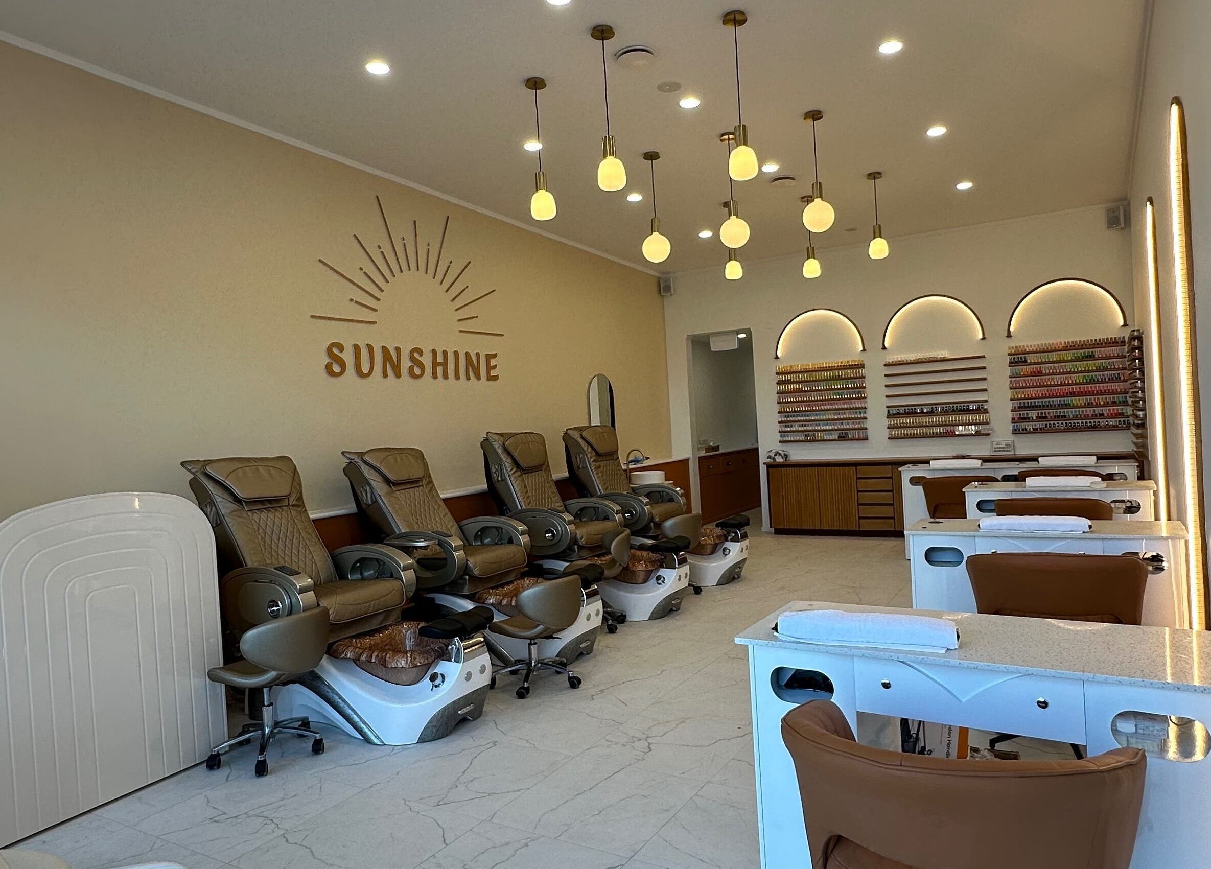 Chic interior of Sunshine Nails & Beauty in Auckland, Auckland, NZ featuring luxurious spa chairs and nail stations.