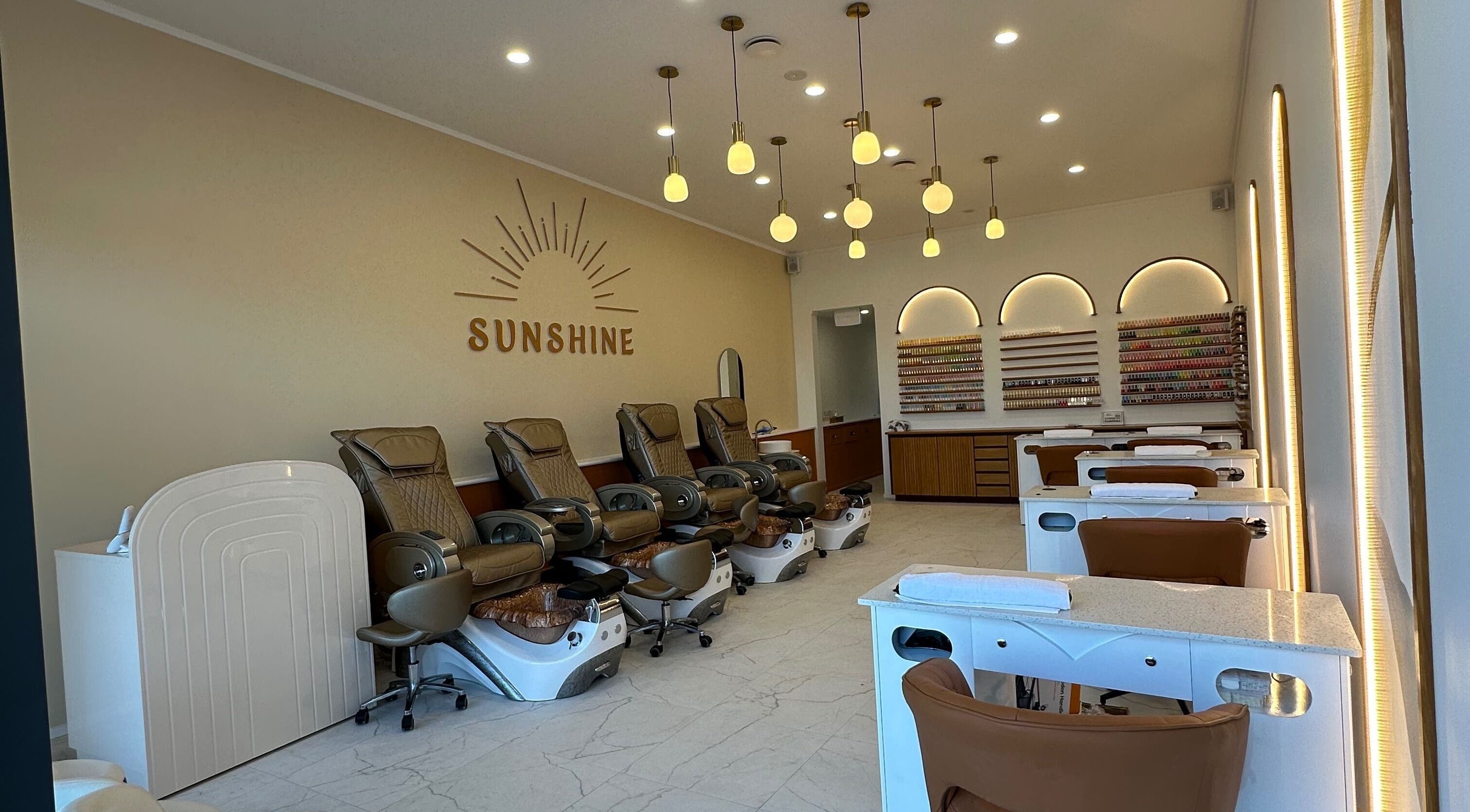 Chic interior of Sunshine Nails & Beauty in Auckland, Auckland, NZ featuring luxurious spa chairs and nail stations.