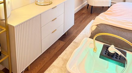 Luxurious treatment room at Me Scalp & Skin Studio, Egham, England, GB, with elegant decor and spa bath.