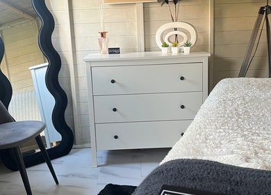 Cozy treatment room at Elyssian - Skincare & Beauty in Southport, England, GB, featuring a sleek mirror and chic decor.