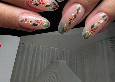 Festive red and green nail art at CutieNailStudio, Glendora, California, US showcasing intricate design.