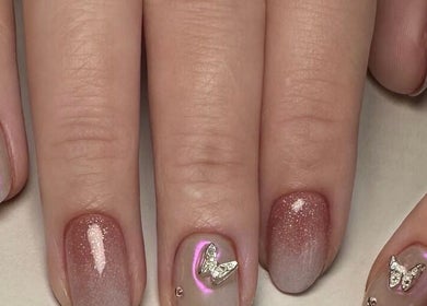 Elegant nail art with shimmer and rhinestones at CutieNailStudio, Glendora, California, US.