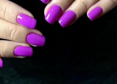 Vibrant purple manicure at CutieNailStudio in Glendora, California, US, showcasing professional nail art.