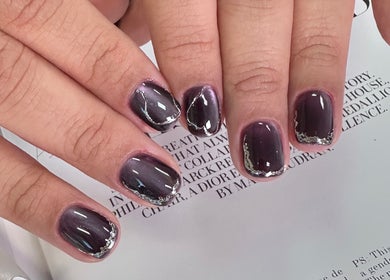 Elegant dark purple manicure with silver accents at CutieNailStudio in Glendora, California, US.