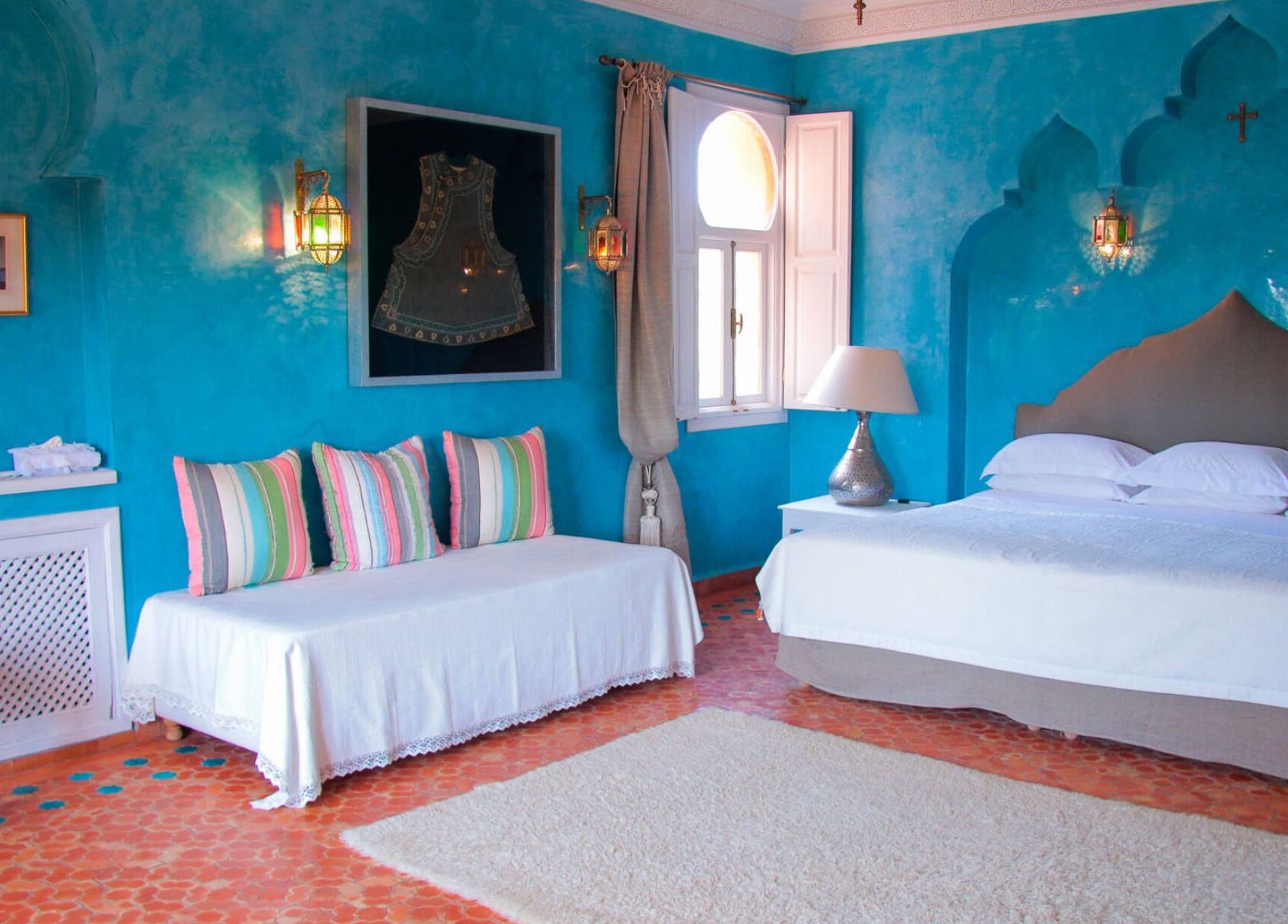 Relax in the vibrant turquoise room at Star Seed + Violet Stopford Retreat Popup in London, England, GB.