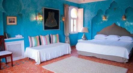 Relax in the vibrant turquoise room at Star Seed + Violet Stopford Retreat Popup in London, England, GB.