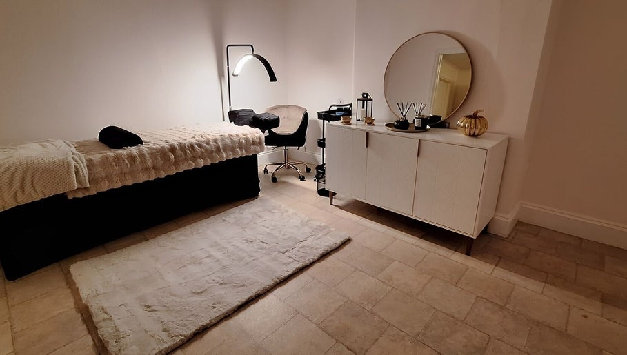 Relaxing spa room at The Beauty and Holistic Lounge Fakenham, Fakenham, England, GB with soft lighting and decor.