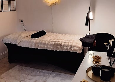 A tranquil treatment room at The Beauty and Holistic Lounge Fakenham, Fakenham, England, GB, with plush decor.