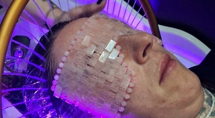 Relaxing crystal mask therapy at The Beauty and Holistic Lounge Fakenham, Fakenham, England, GB with purple lighting.