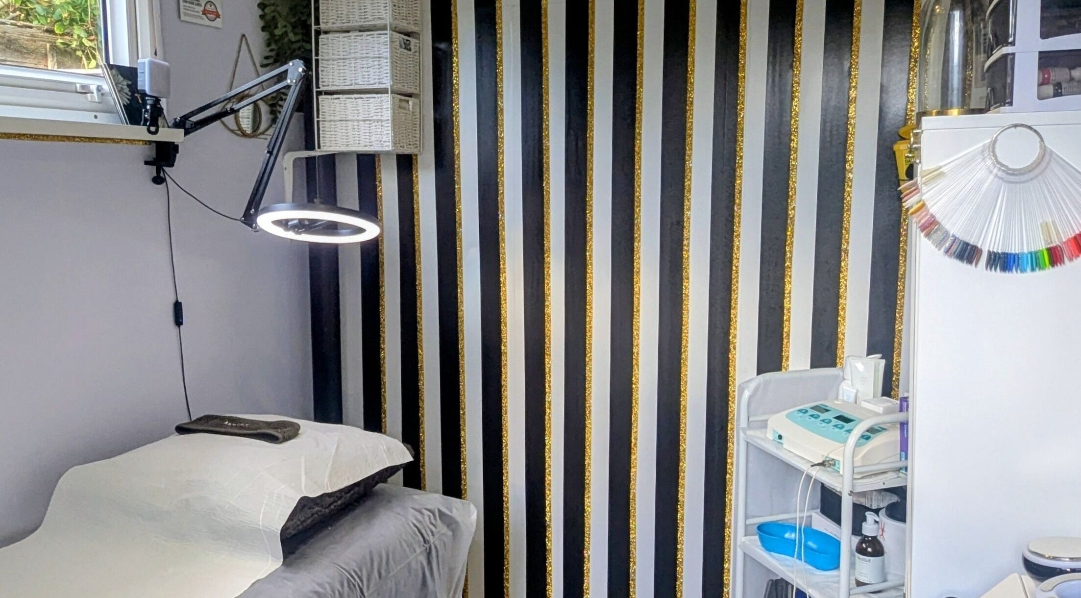 Modern treatment room at The Skin Aesthetic Hive in Worthing, England, GB, featuring stylish decor and equipment.