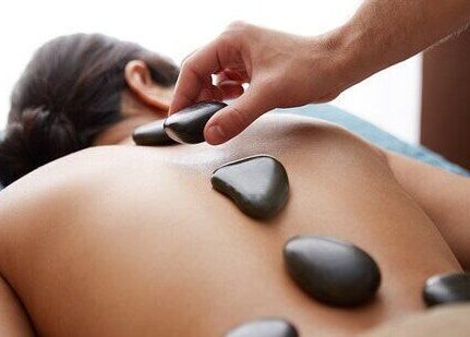 Hot stone massage at Ware Therapeutic Massage Acupuncture Windermere in Edmonton, Alberta, CA.