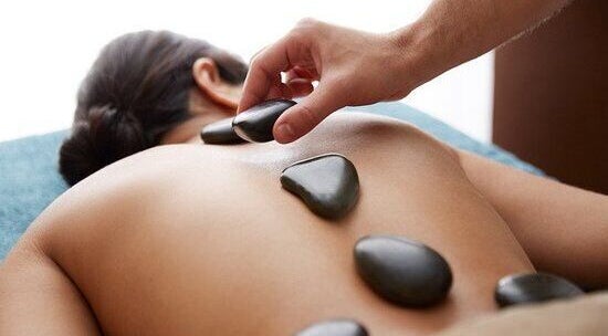 Hot stone massage at Ware Therapeutic Massage Acupuncture Windermere in Edmonton, Alberta, CA.
