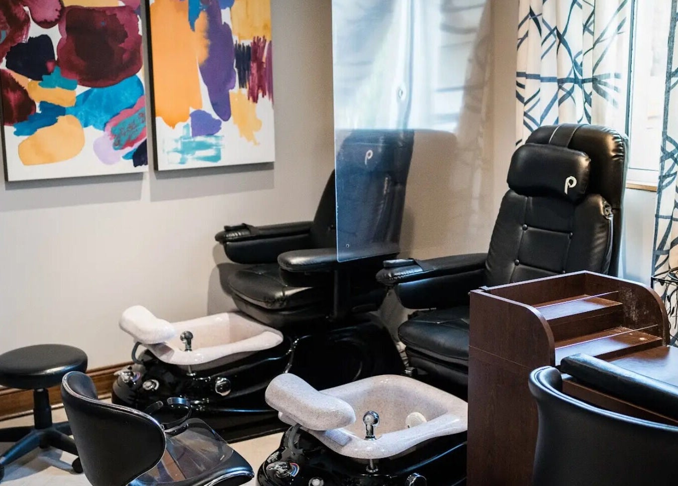 Luxurious pedicure stations at Francesco and Giovanni Salon, Eagleville, Pennsylvania, US, with colorful art decor.