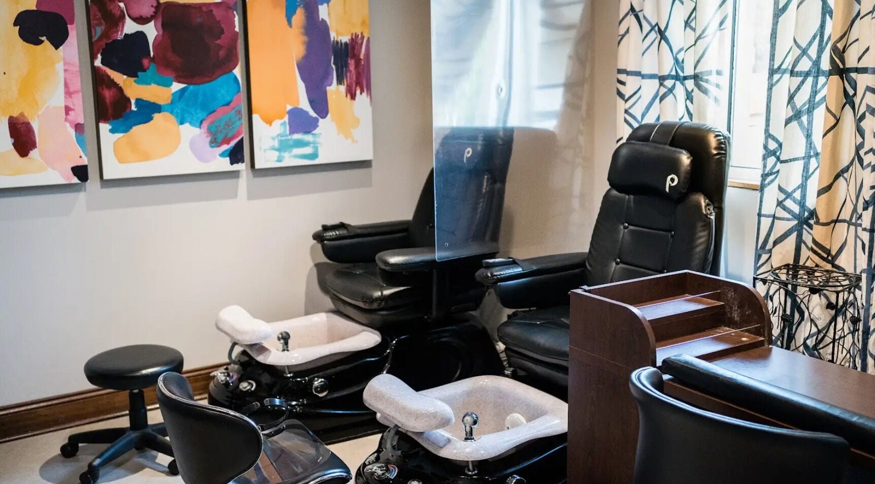 Luxurious pedicure stations at Francesco and Giovanni Salon, Eagleville, Pennsylvania, US, with colorful art decor.