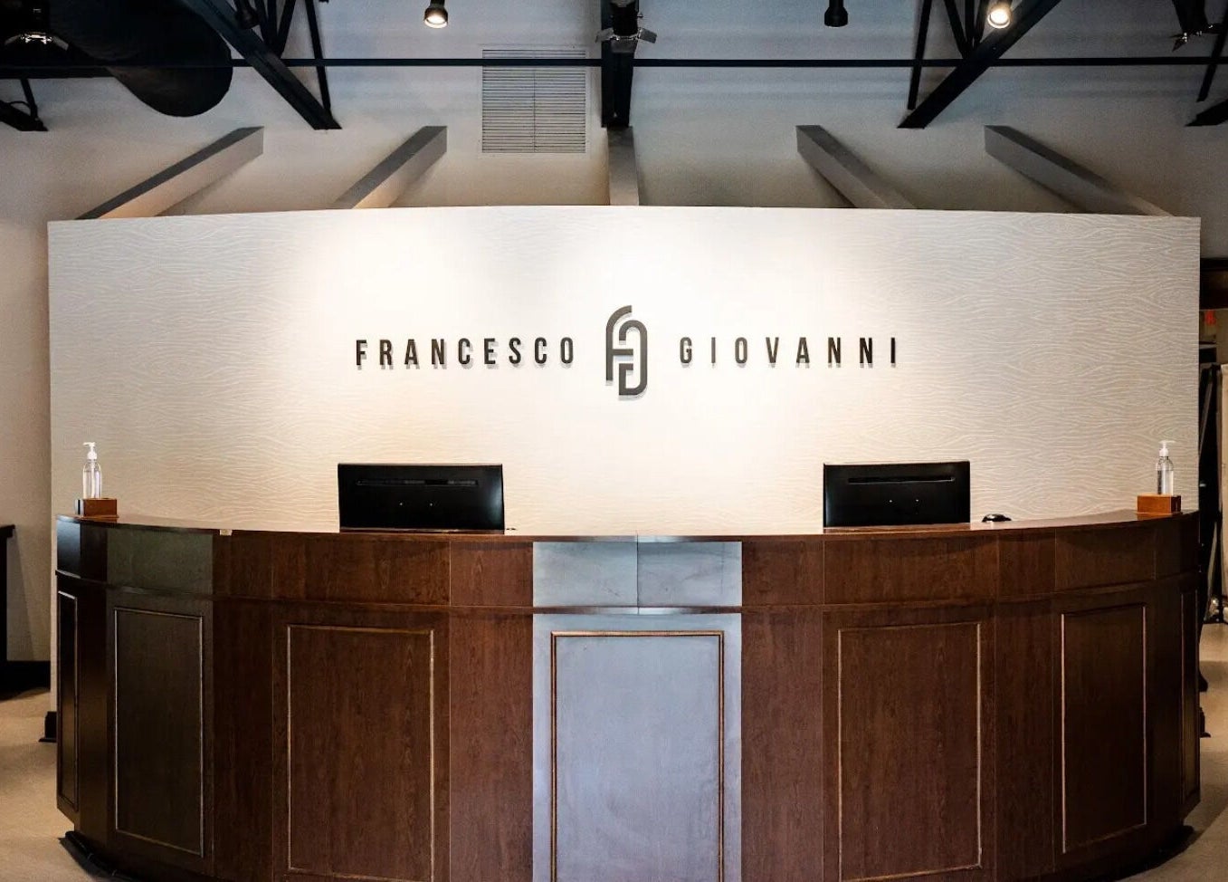 Reception desk at Francesco and Giovanni Salon, Eagleville, Pennsylvania, US, showcasing modern elegance.