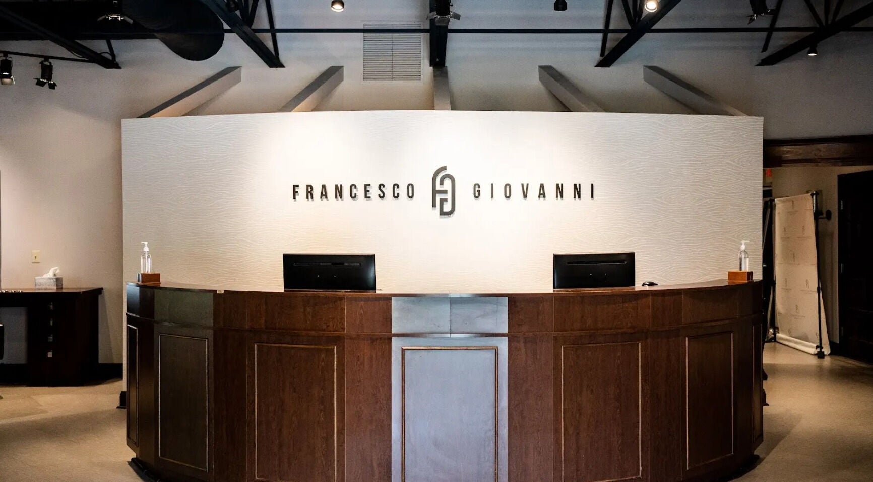 Reception desk at Francesco and Giovanni Salon, Eagleville, Pennsylvania, US, showcasing modern elegance.