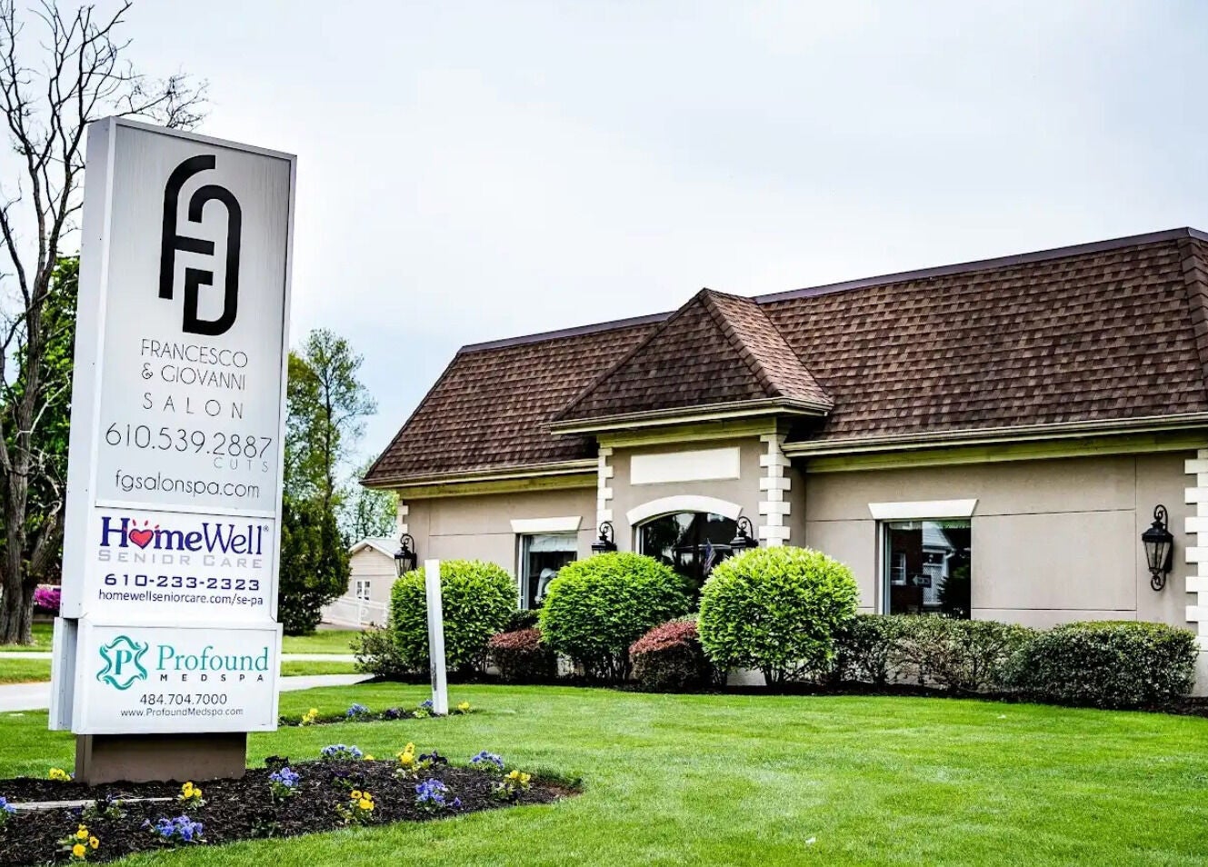 Francesco and Giovanni Salon's stylish exterior in Eagleville, Pennsylvania, US with lush landscaping.