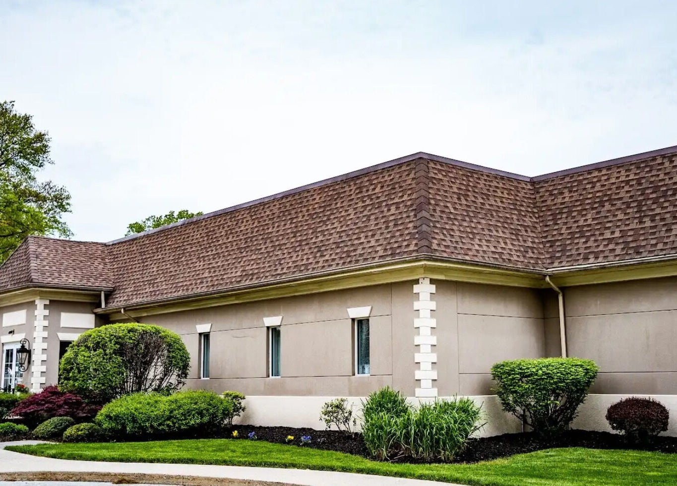 Modern exterior of Francesco and Giovanni Salon in Eagleville, Pennsylvania, US with well-kept landscaping.