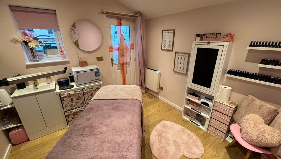 Chic interior of The Pink Beauty Room in Huddersfield, England, GB, featuring a cozy treatment area.