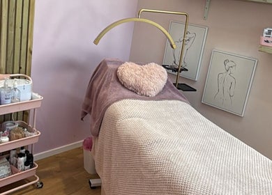 Relaxing treatment room at The Pink Beauty Room, Huddersfield, England, GB, featuring cozy pink decor.