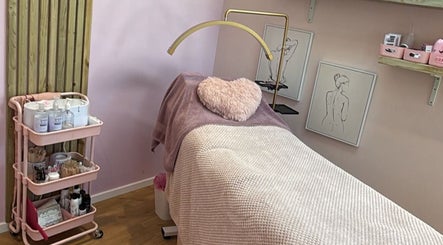 Relaxing treatment room at The Pink Beauty Room, Huddersfield, England, GB, featuring cozy pink decor.