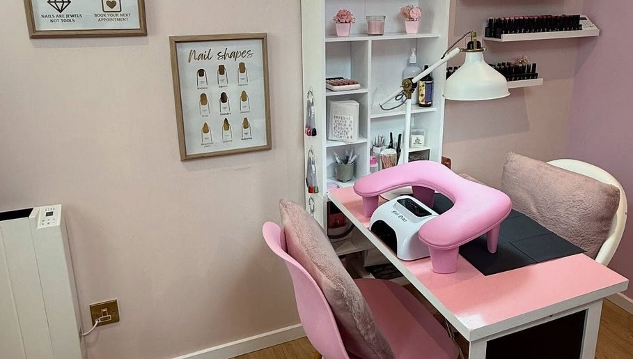 Manicure station at The Pink Beauty Room, Huddersfield, England, GB with pink decor and nail equipment.