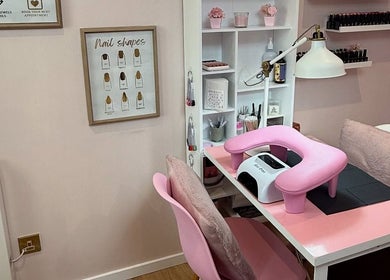 Manicure station at The Pink Beauty Room, Huddersfield, England, GB with pink decor and nail equipment.