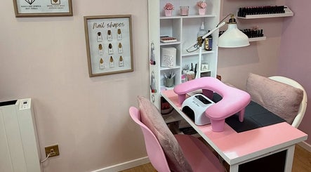 Manicure station at The Pink Beauty Room, Huddersfield, England, GB with pink decor and nail equipment.