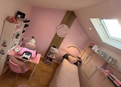 Cozy interior of The Pink Beauty Room, Huddersfield, England, GB, featuring pink decor and modern beauty setup.