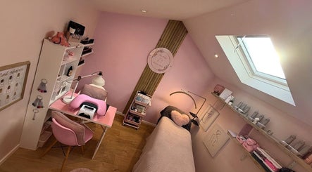 Cozy interior of The Pink Beauty Room, Huddersfield, England, GB, featuring pink decor and modern beauty setup.