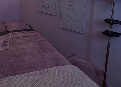 Cozy treatment room with soft lighting at The Pink Beauty Room, Huddersfield, England, GB.