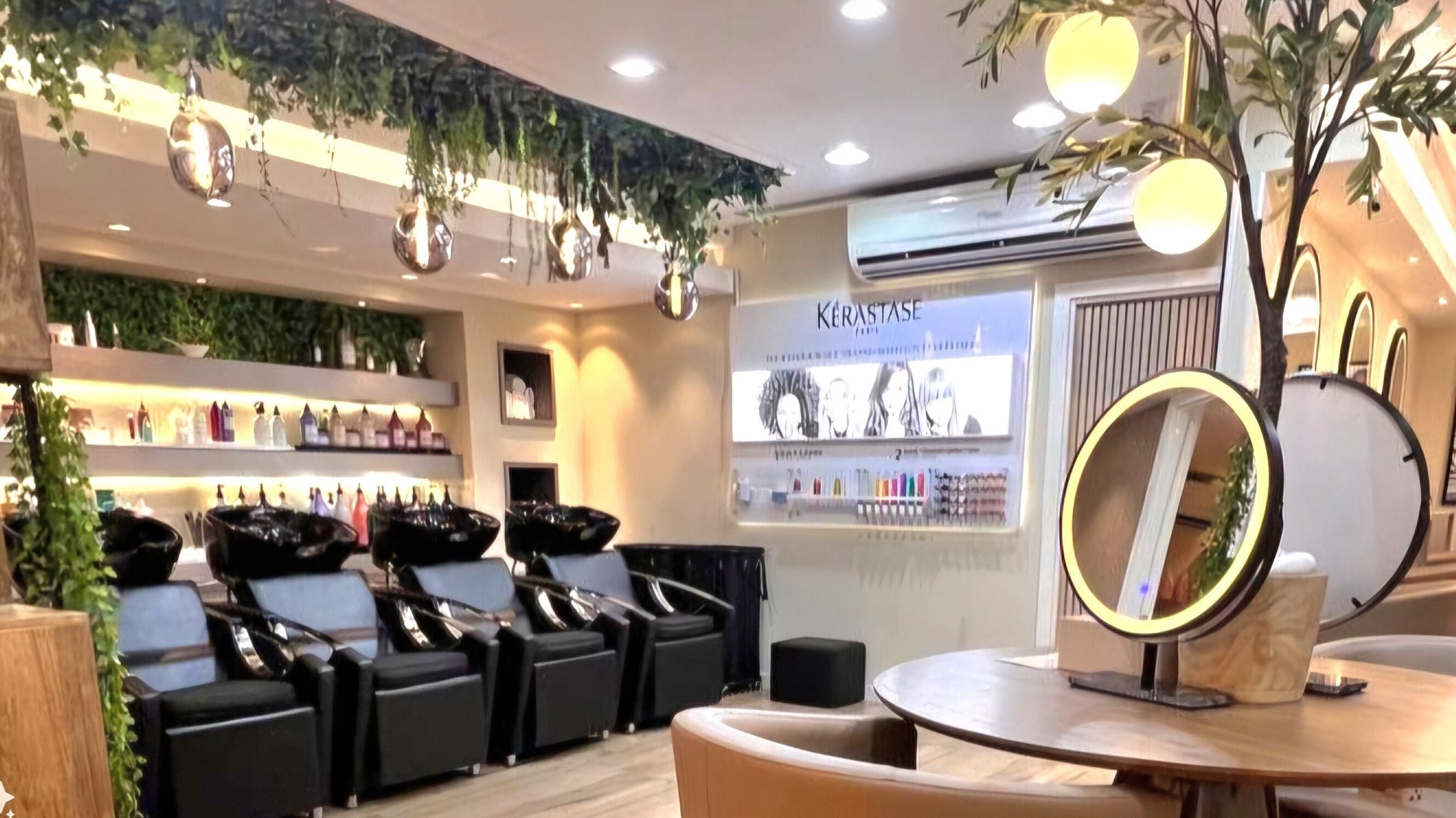 Inside Version Francaise - Hair & Beauty Salon, Dubai, Dubai, AE, showcasing chic styling stations and greenery.