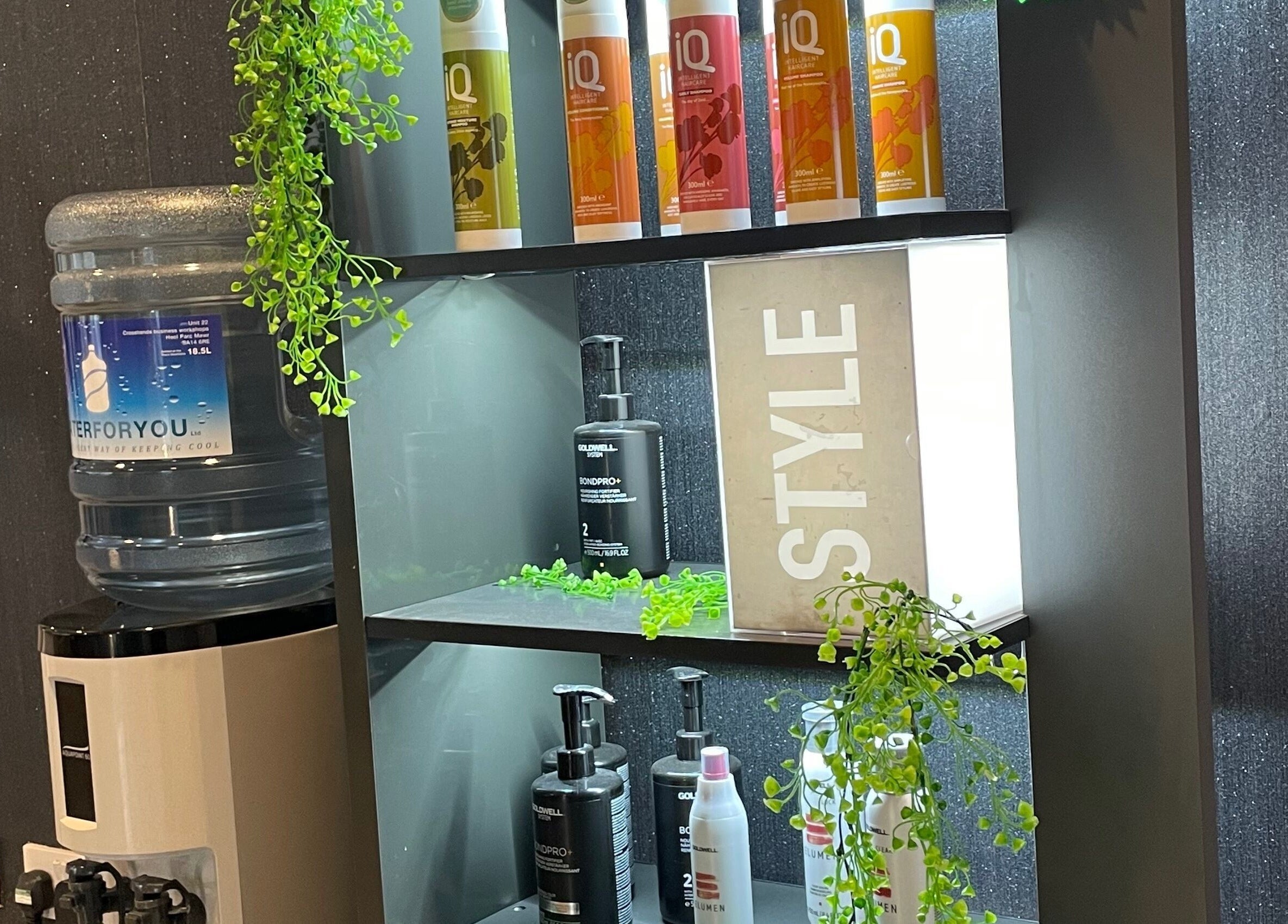 Shelf with beauty products at La’torias at Kidwelly, Kidwelly, Wales, GB. Stylish display with greenery.
