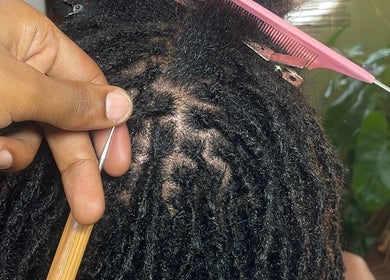 Loc styling at HONEYBODY BEAUTY BAR & THE LOC HIVE, May Pen, Clarendon, JM, showcasing intricate braid technique.
